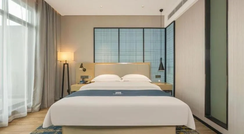 Bed in Echarm Hotel Fangchenggang Qisha