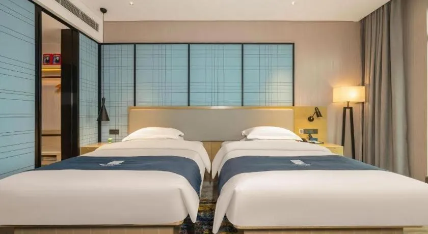 Bed in Echarm Hotel Fangchenggang Qisha