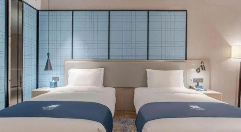 Bed in Echarm Hotel Fangchenggang Qisha