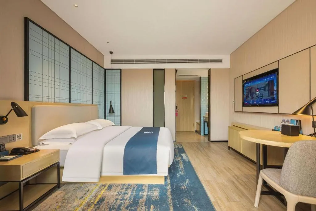 Bed in Echarm Hotel Fangchenggang Qisha