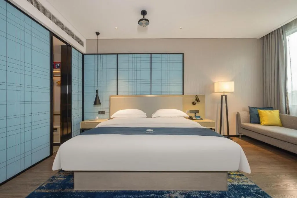 Bed in Echarm Hotel Fangchenggang Qisha