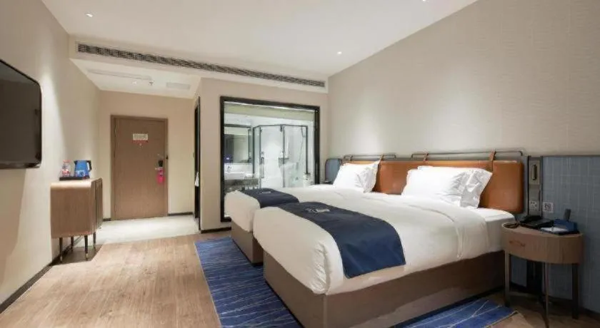 Bed in Echarm Hotel Liuzhou Yaobu Ancient Town