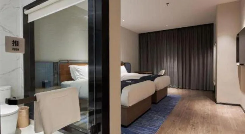 Bed in Echarm Hotel Liuzhou Yaobu Ancient Town