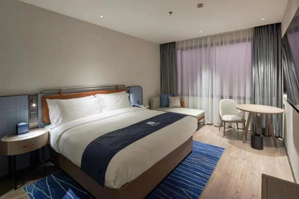 Bed in Echarm Hotel Liuzhou Yaobu Ancient Town