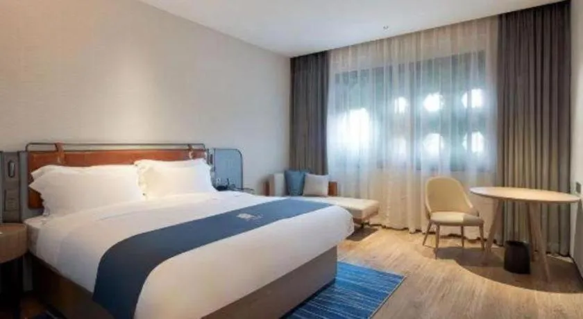 Bed in Echarm Hotel Liuzhou Yaobu Ancient Town