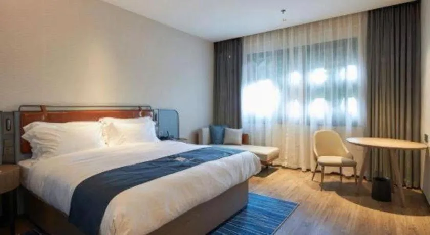 Bed in Echarm Hotel Liuzhou Yaobu Ancient Town