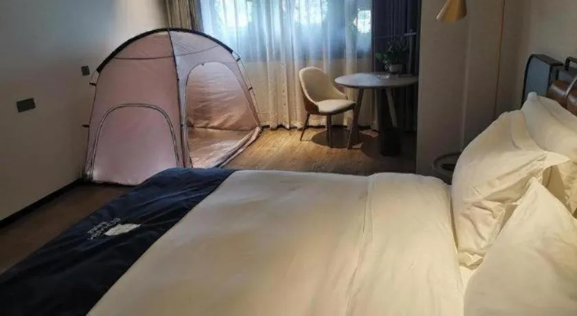 Bed in Echarm Hotel Liuzhou Yaobu Ancient Town