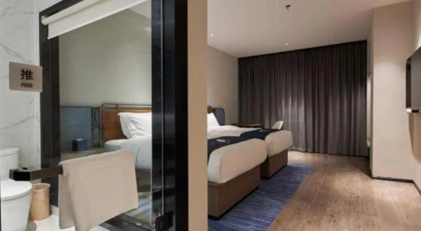 Bed in Echarm Hotel Liuzhou Yaobu Ancient Town