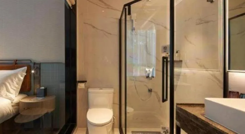 Bed in Echarm Hotel Liuzhou Yaobu Ancient Town