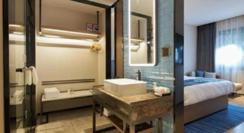 Bed in Echarm Hotel Liuzhou Yaobu Ancient Town