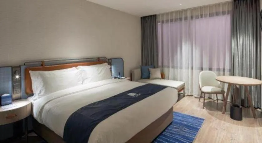 Bed in Echarm Hotel Liuzhou Yaobu Ancient Town