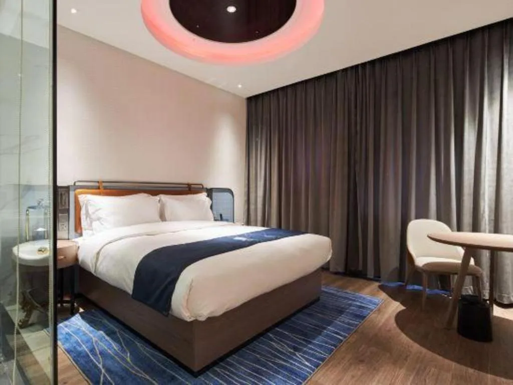 Bed in Echarm Hotel Liuzhou Yaobu Ancient Town