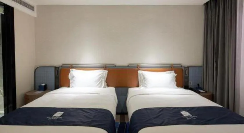 Bed in Echarm Hotel Liuzhou Yaobu Ancient Town