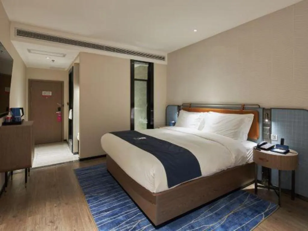 Bed in Echarm Hotel Liuzhou Yaobu Ancient Town