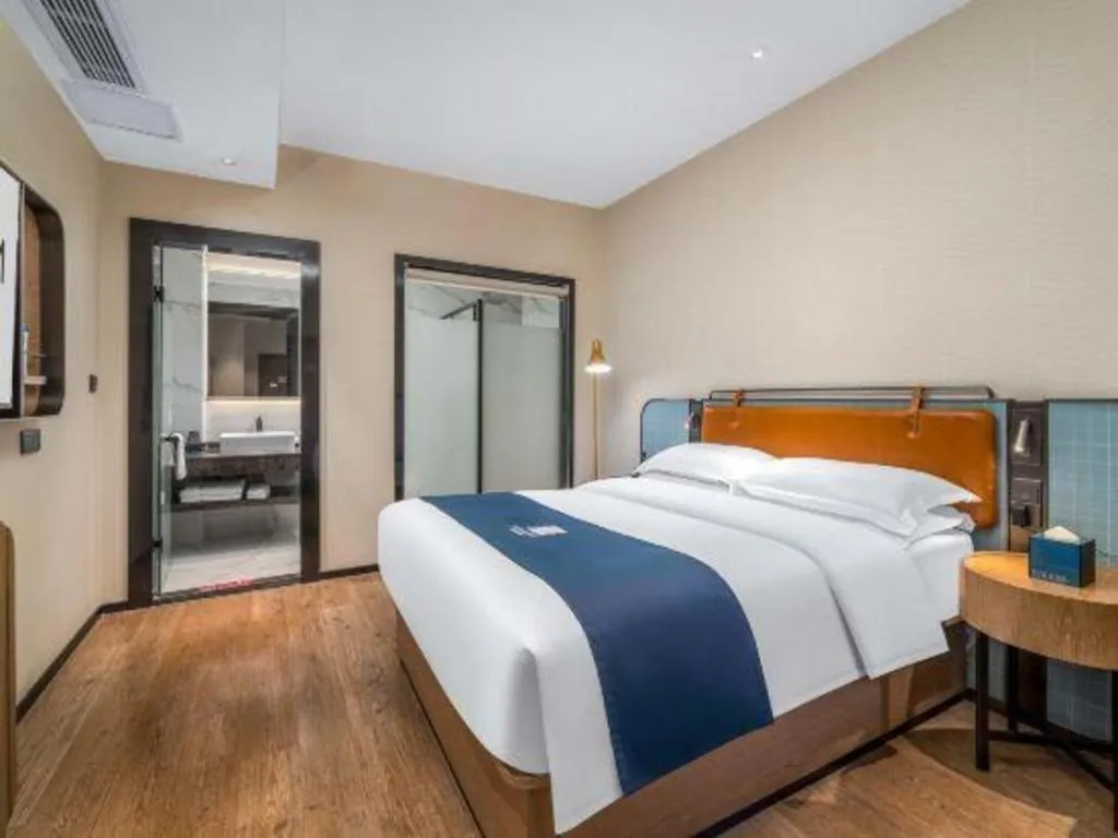 Bed in Echarm Hotel Liuzhou Yaobu Ancient Town