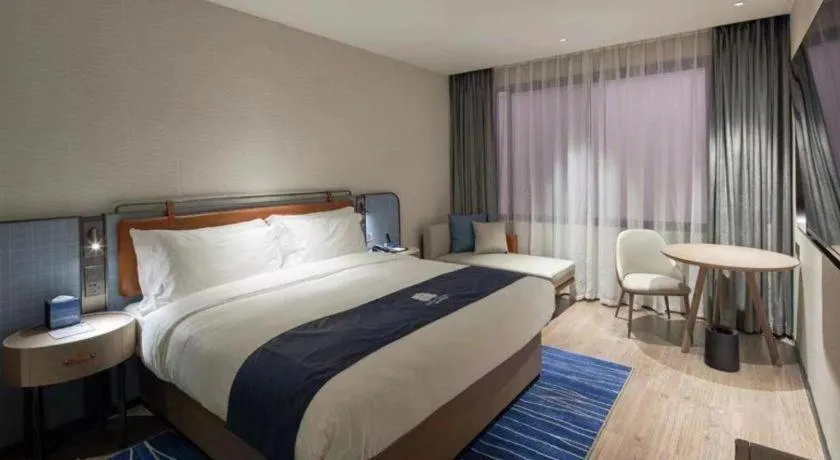 Bed in Echarm Hotel Liuzhou Yaobu Ancient Town