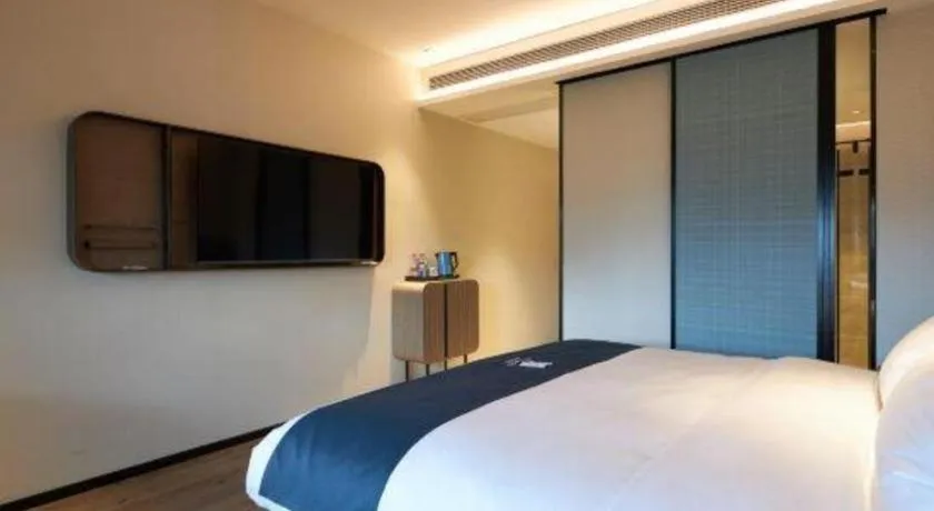 Bed in Echarm Hotel Liuzhou Yaobu Ancient Town