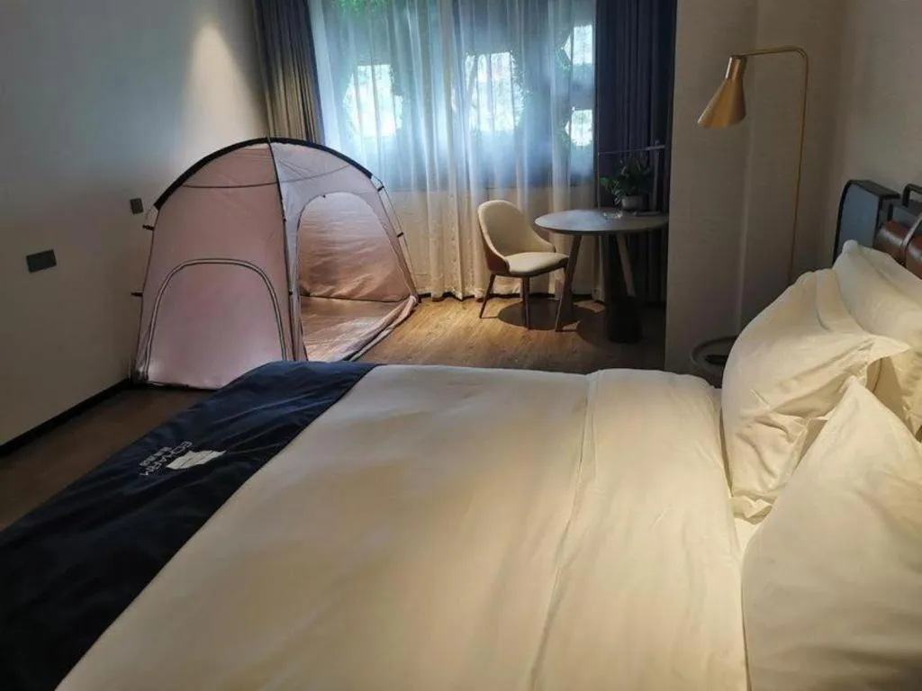 Bed in Echarm Hotel Liuzhou Yaobu Ancient Town