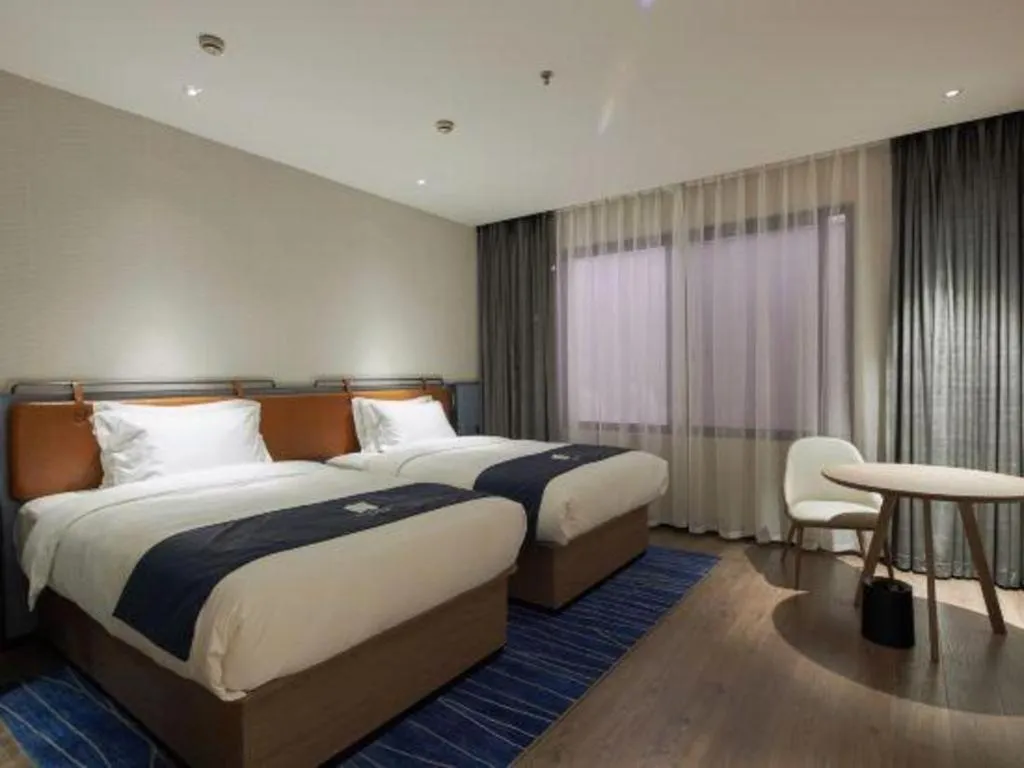 Bed in Echarm Hotel Liuzhou Yaobu Ancient Town