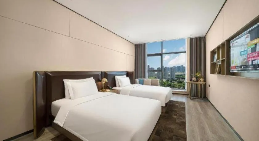 Bed in Premier City Comfort Hotel Quanzhou Wanda Plaza