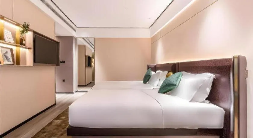 Bed in Premier City Comfort Hotel Quanzhou Wanda Plaza