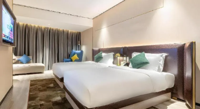 Bed in Premier City Comfort Hotel Quanzhou Wanda Plaza