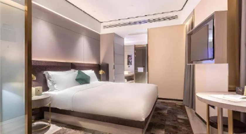 Bed in Premier City Comfort Hotel Quanzhou Wanda Plaza