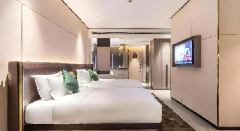 Bed in Premier City Comfort Hotel Quanzhou Wanda Plaza