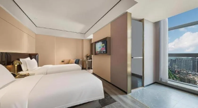 Bed in Premier City Comfort Hotel Quanzhou Wanda Plaza