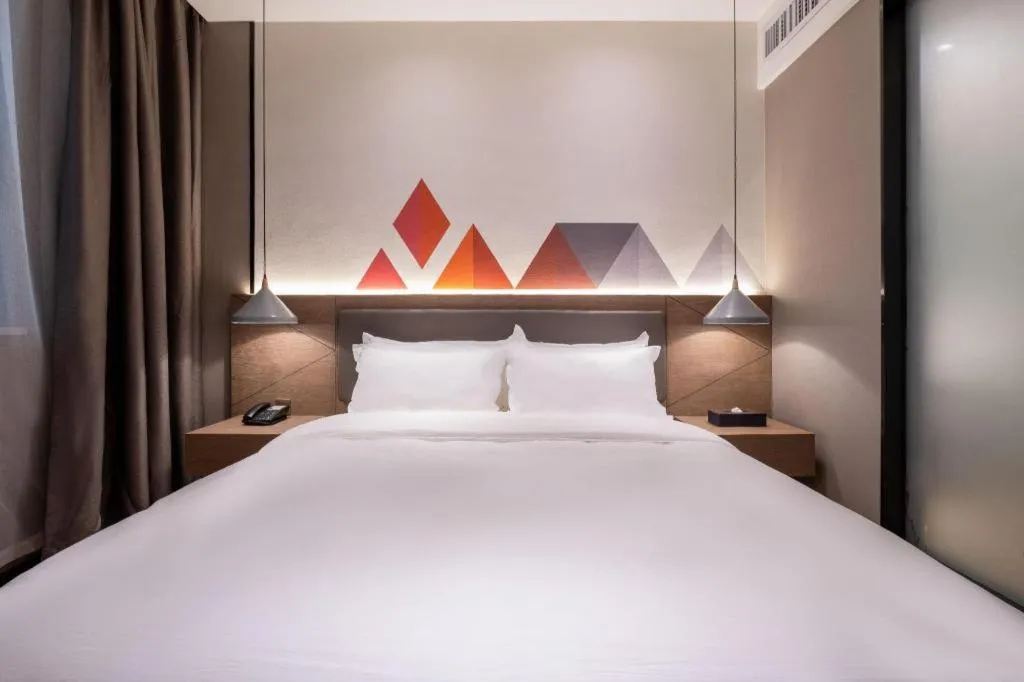 Bed in Borrman Hotel Zhonghsan Guzheng Huayi Plaza Light Rail Station