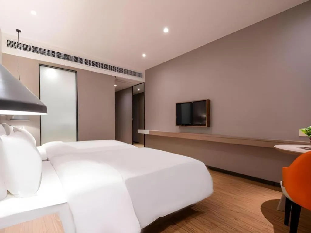 Bed in Borrman Hotel Zhonghsan Guzheng Huayi Plaza Light Rail Station