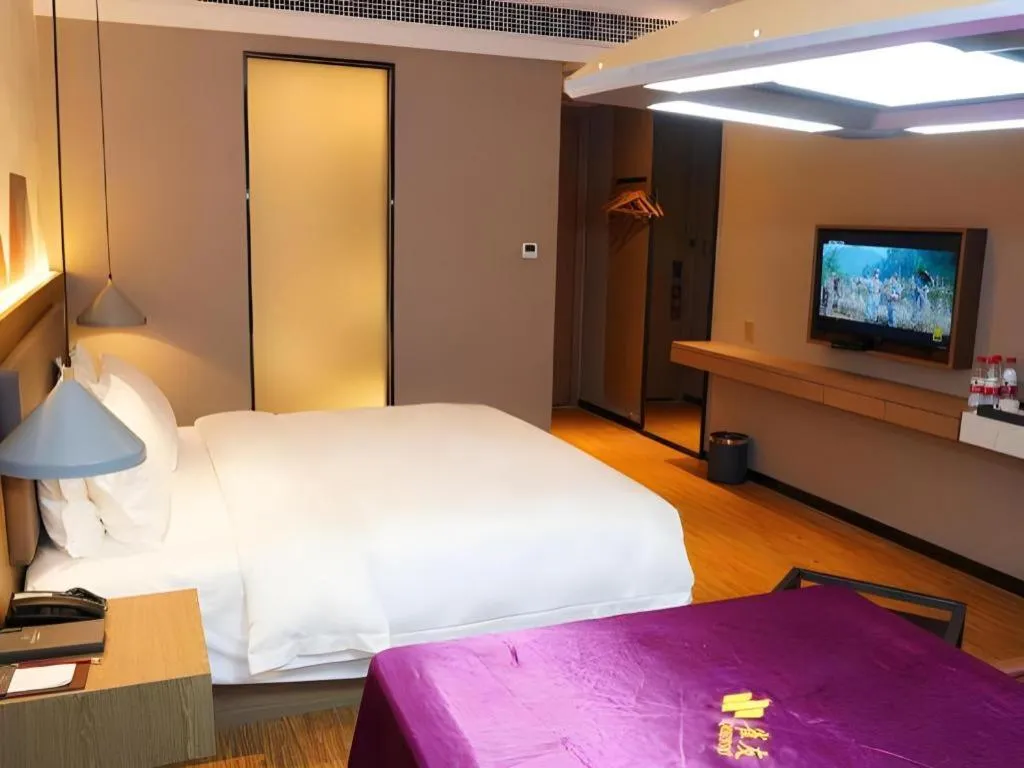 Bed in Borrman Hotel Zhonghsan Guzheng Huayi Plaza Light Rail Station