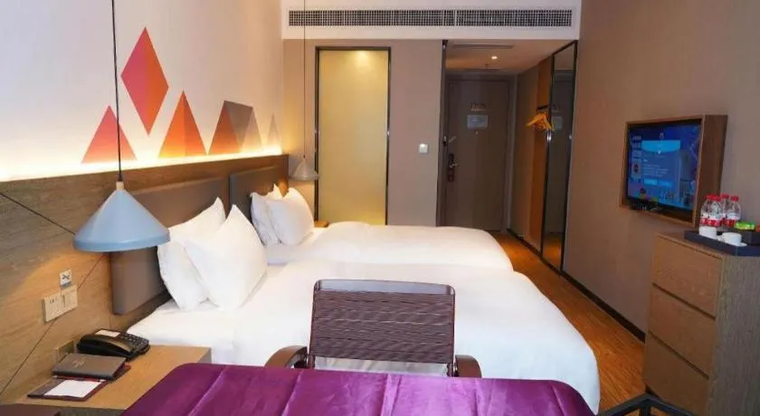 Bed in Borrman Hotel Zhonghsan Guzheng Huayi Plaza Light Rail Station