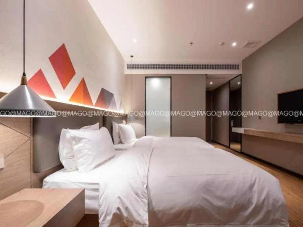 Bed in Borrman Hotel Zhonghsan Guzheng Huayi Plaza Light Rail Station