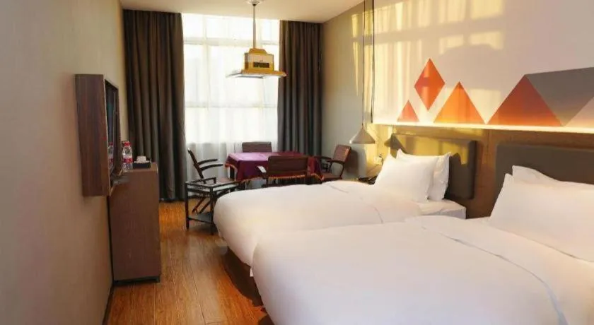 Bed in Borrman Hotel Zhonghsan Guzheng Huayi Plaza Light Rail Station