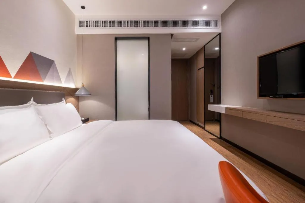 Bed in Borrman Hotel Zhonghsan Guzheng Huayi Plaza Light Rail Station