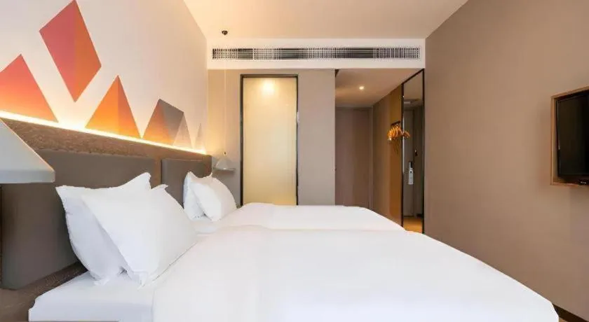 Bed in Borrman Hotel Zhonghsan Guzheng Huayi Plaza Light Rail Station