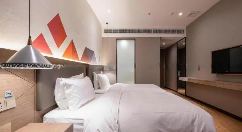 Bed in Borrman Hotel Zhonghsan Guzheng Huayi Plaza Light Rail Station