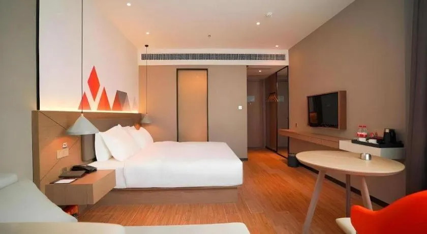 Bed in Borrman Hotel Zhonghsan Guzheng Huayi Plaza Light Rail Station