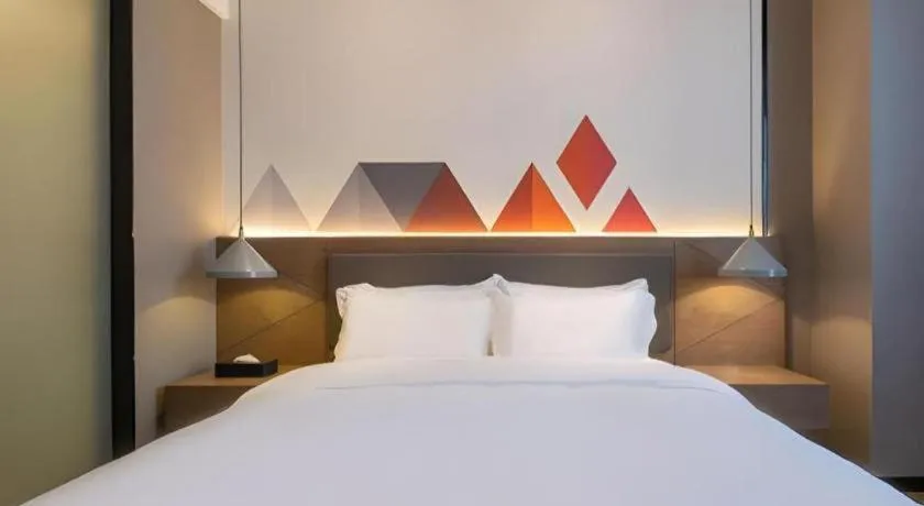 Bed in Borrman Hotel Zhonghsan Guzheng Huayi Plaza Light Rail Station