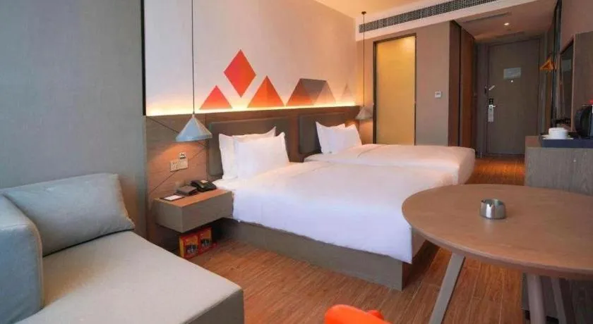 Bed in Borrman Hotel Zhonghsan Guzheng Huayi Plaza Light Rail Station