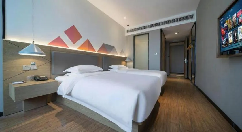 Bed in Borrman Hotel Zhonghsan Guzheng Huayi Plaza Light Rail Station