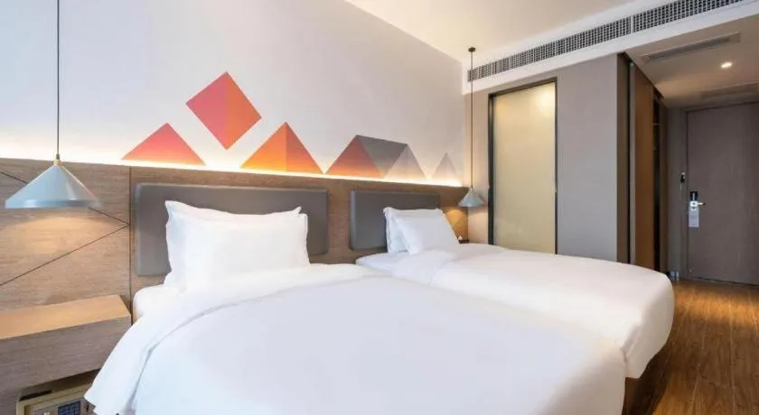 Bed in Borrman Hotel Zhonghsan Guzheng Huayi Plaza Light Rail Station