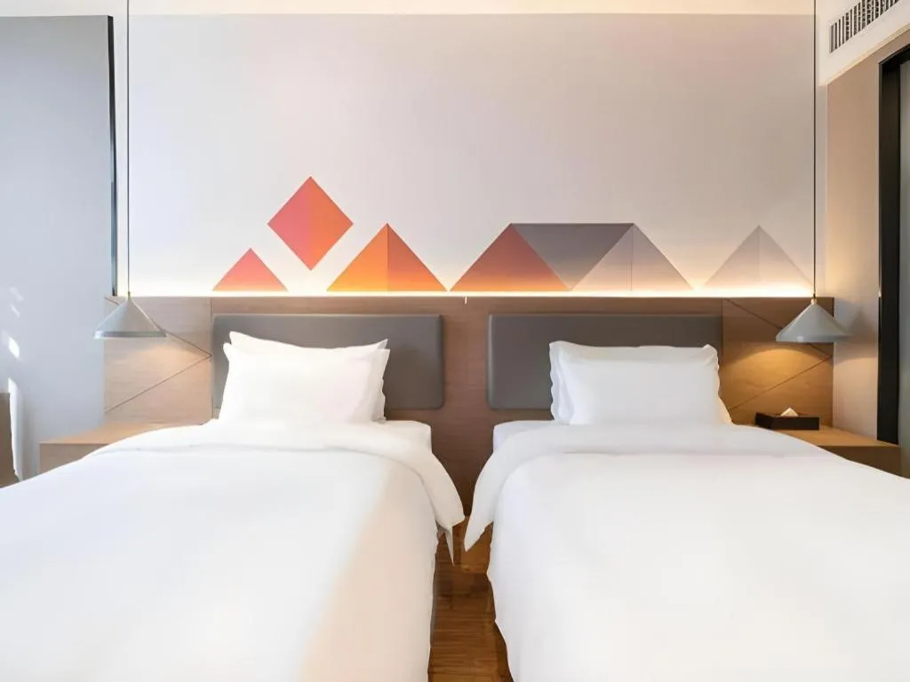 Bed in Borrman Hotel Zhonghsan Guzheng Huayi Plaza Light Rail Station