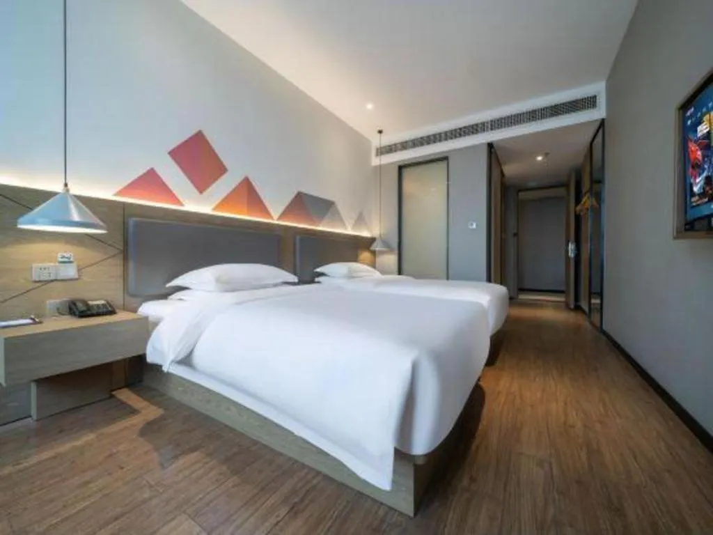 Bed in Borrman Hotel Zhonghsan Guzheng Huayi Plaza Light Rail Station