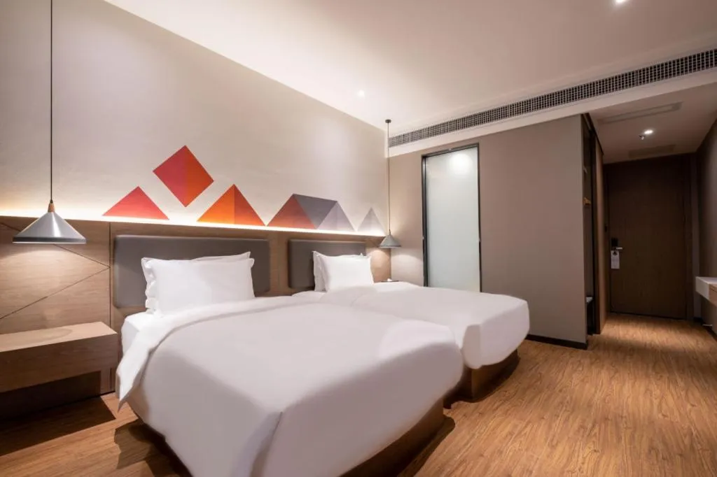 Bed in Borrman Hotel Zhonghsan Guzheng Huayi Plaza Light Rail Station