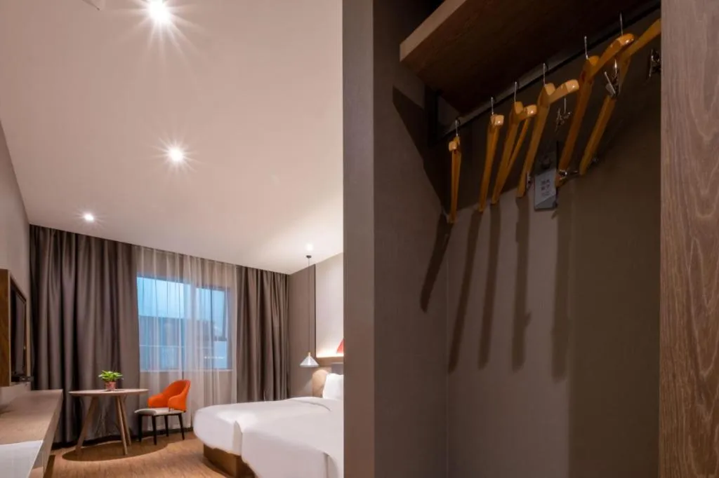 Bed in Borrman Hotel Zhonghsan Guzheng Huayi Plaza Light Rail Station