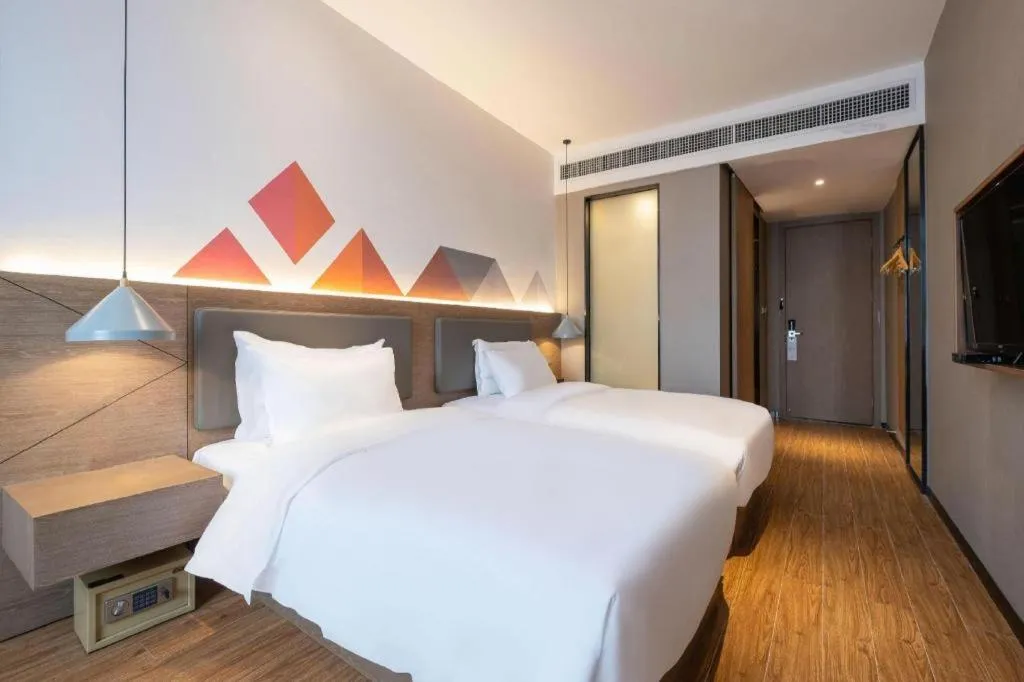 Bed in Borrman Hotel Zhonghsan Guzheng Huayi Plaza Light Rail Station