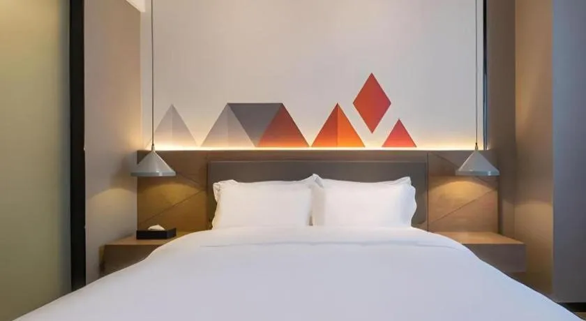 Bed in Borrman Hotel Zhonghsan Guzheng Huayi Plaza Light Rail Station