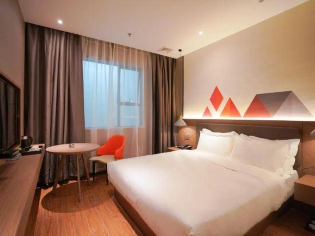 Bed in Borrman Hotel Zhonghsan Guzheng Huayi Plaza Light Rail Station
